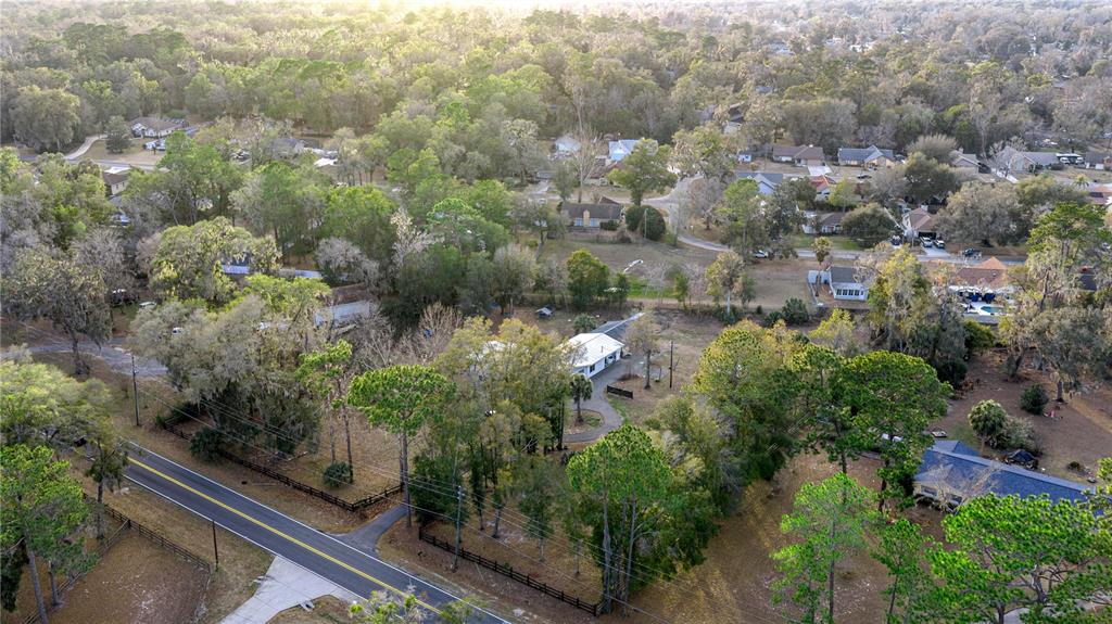 5100 Southeast 44th Avenue Road Ocala, FL 34480 - Photo 12 of 41 an aerial view of residential house with outdoor space and trees all around