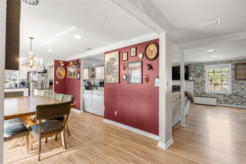 5100 Southeast 44th Avenue Road Ocala, FL 34480 - Photo 16 of 41 a view of a kitchen with furniture and wooden floor