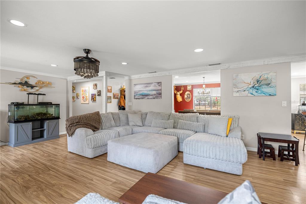 5100 Southeast 44th Avenue Road Ocala, FL 34480 - Photo 22 of 41 a living room with furniture and wooden floor
