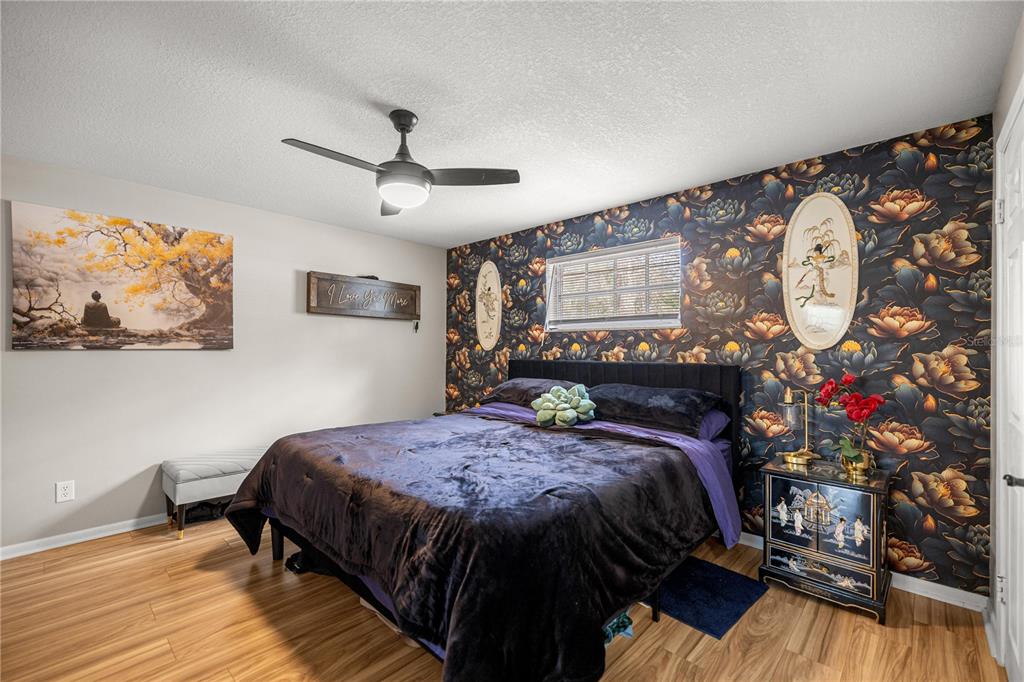 5100 Southeast 44th Avenue Road Ocala, FL 34480 - Photo 30 of 41 a bed sitting in a bedroom next to a window