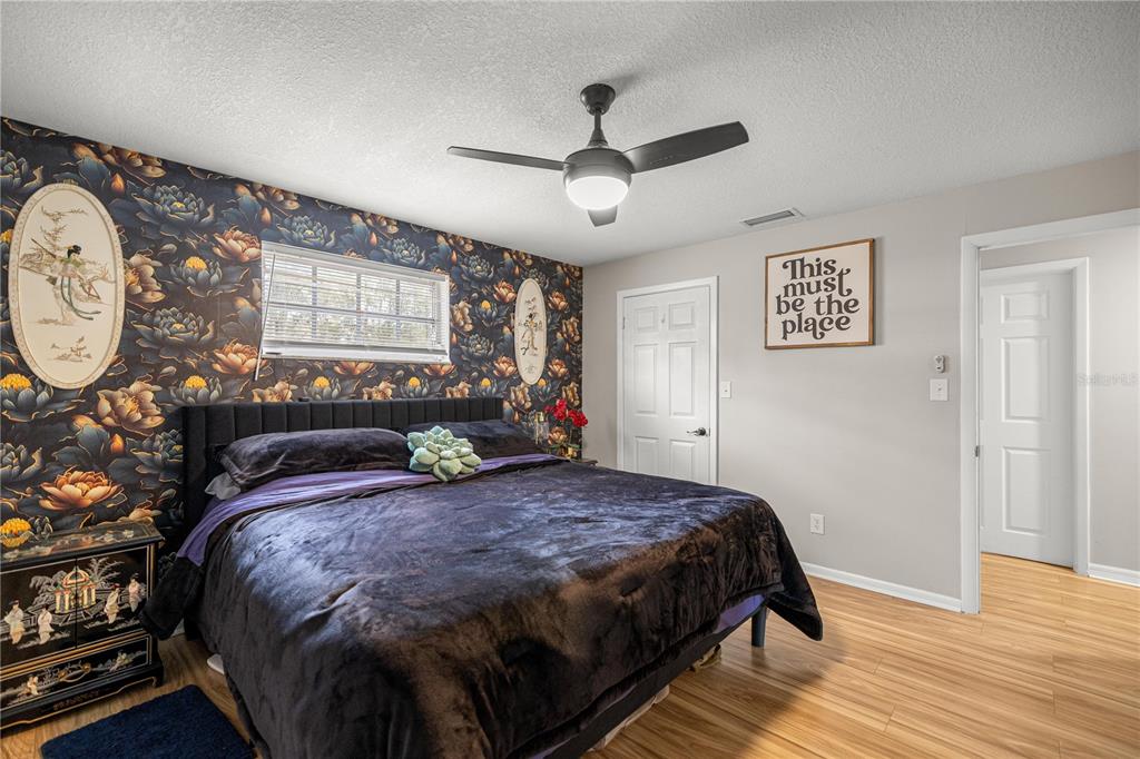 5100 Southeast 44th Avenue Road Ocala, FL 34480 - Photo 31 of 41 a large bed sitting in a bedroom next to a window