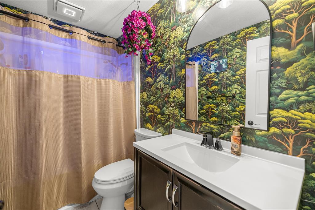 5100 Southeast 44th Avenue Road Ocala, FL 34480 - Photo 33 of 41 a bathroom with a sink toilet and shower