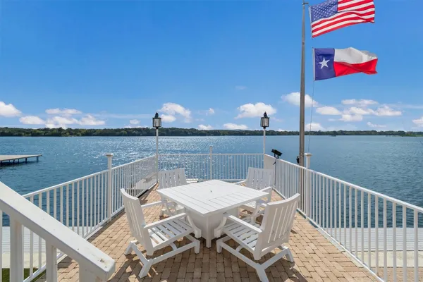 a view of a balcony with furniture
