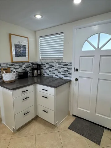 a kitchen with a stove and cabinets