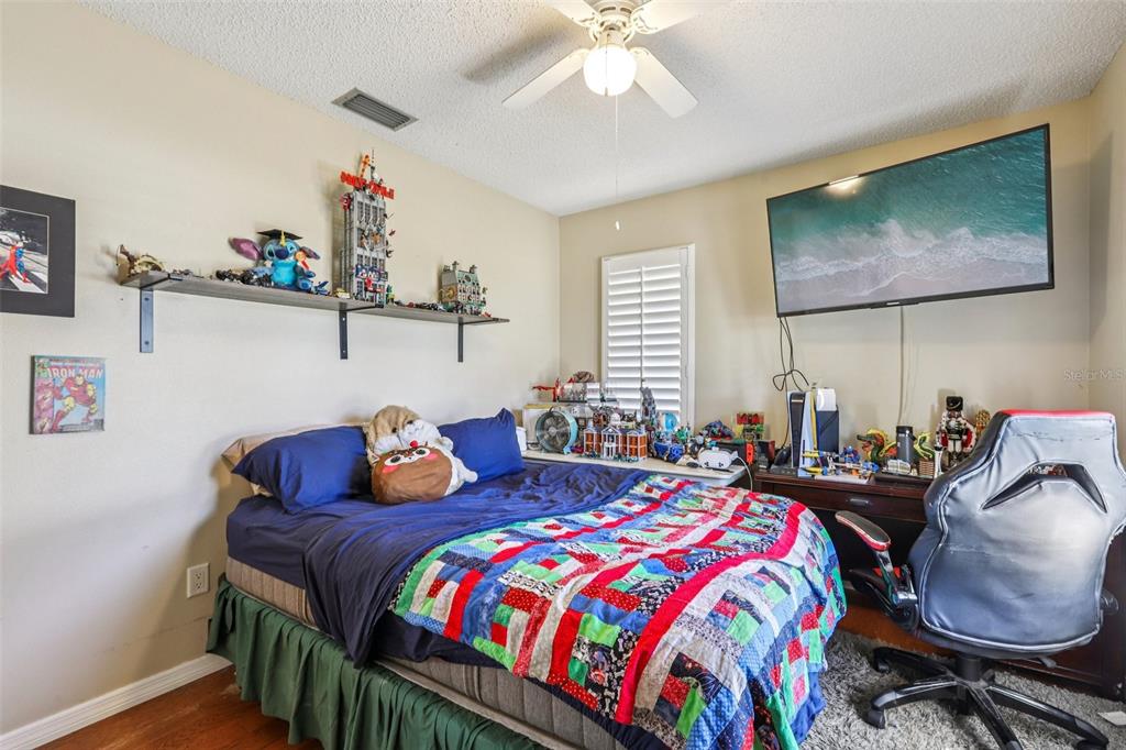 3050 Crump Road Winter Haven, FL 33881 - Photo 29 of 98 a bedroom with bed and windows