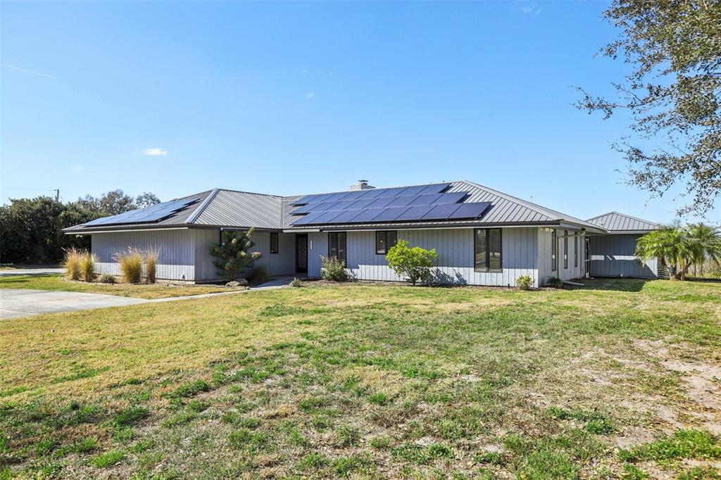 3050 Crump Road Winter Haven, FL 33881 - Photo 4 of 98 a front view of a house with a garden