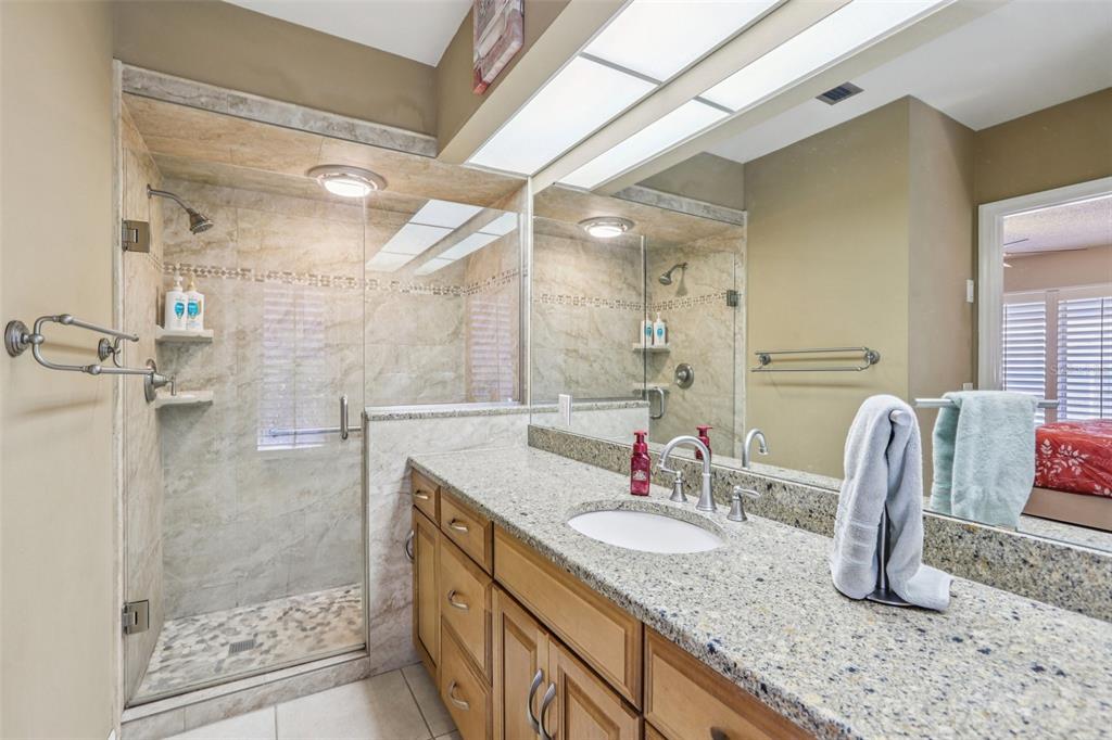 3050 Crump Road Winter Haven, FL 33881 - Photo 41 of 98 a bathroom with a granite countertop sink and a mirror
