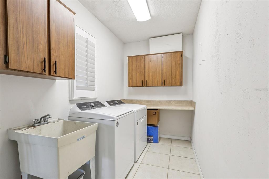 3050 Crump Road Winter Haven, FL 33881 - Photo 50 of 98 a utility room with a sink washer and dryer