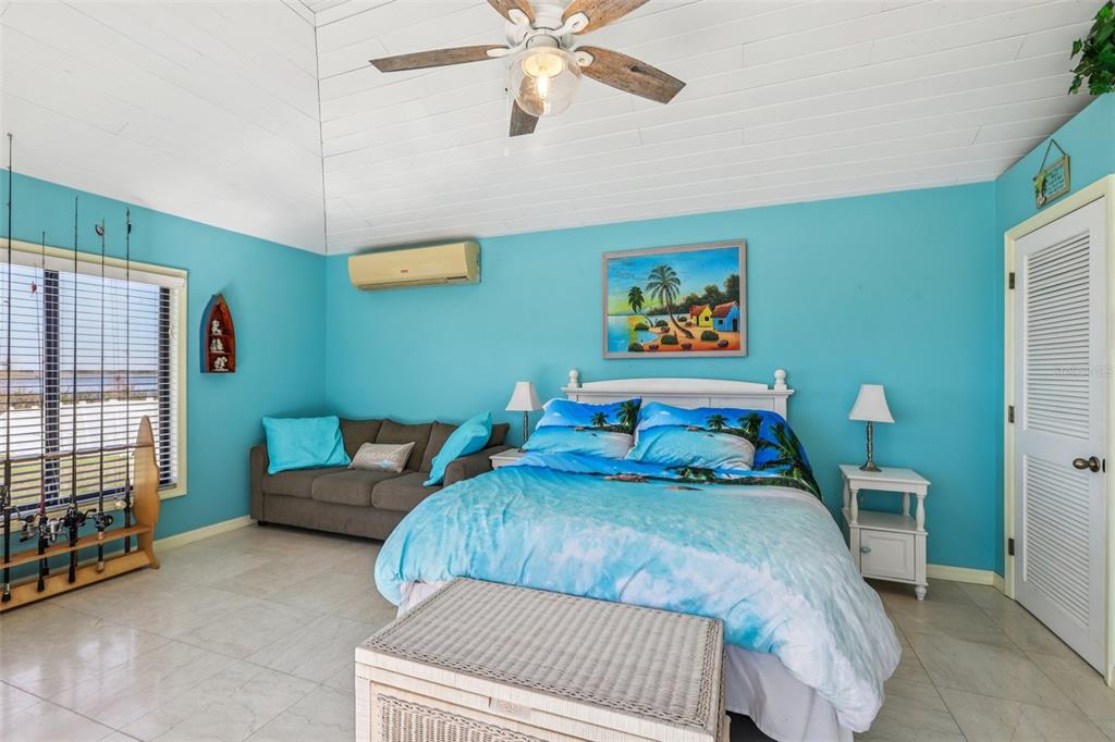 3050 Crump Road Winter Haven, FL 33881 - Photo 55 of 98 a bedroom with 2 bed and a chandelier