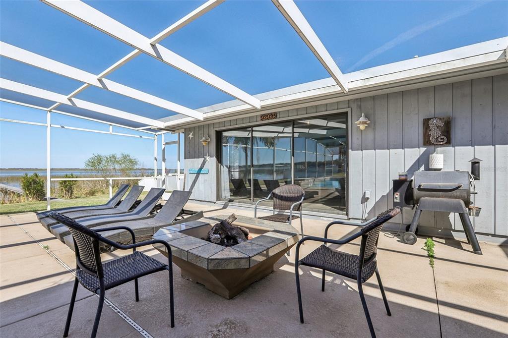 3050 Crump Road Winter Haven, FL 33881 - Photo 66 of 98 a view of a patio with table and chairs