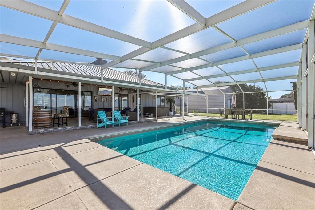 3050 Crump Road Winter Haven, FL 33881 - Photo 68 of 98 a view of a porch with a table and chairs