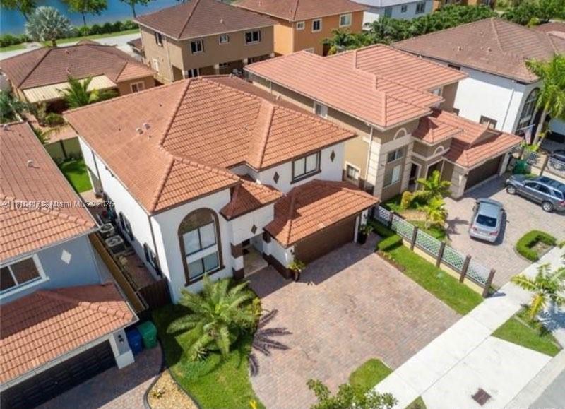 16588 Southwest 44th Street Miami, FL 33185 - Photo 2 of 14 an aerial view of a house with garden