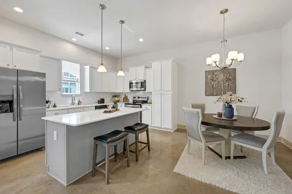 a kitchen with a sink cabinets and window