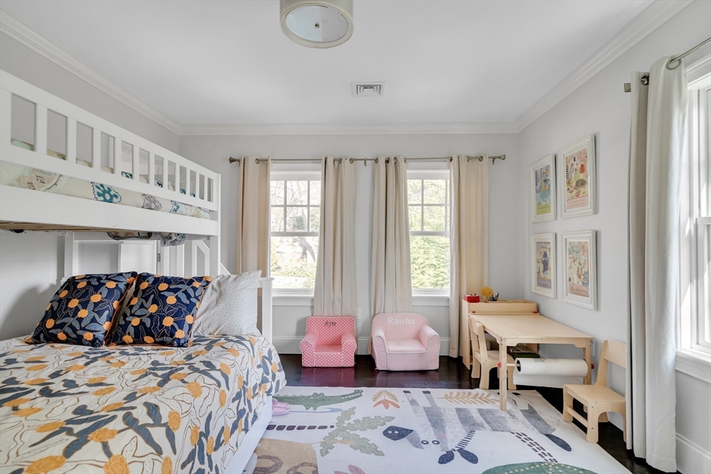 80 Buckman Drive Lexington, MA 02421 - Photo 14 of 29 a bedroom with a bed and wooden floor