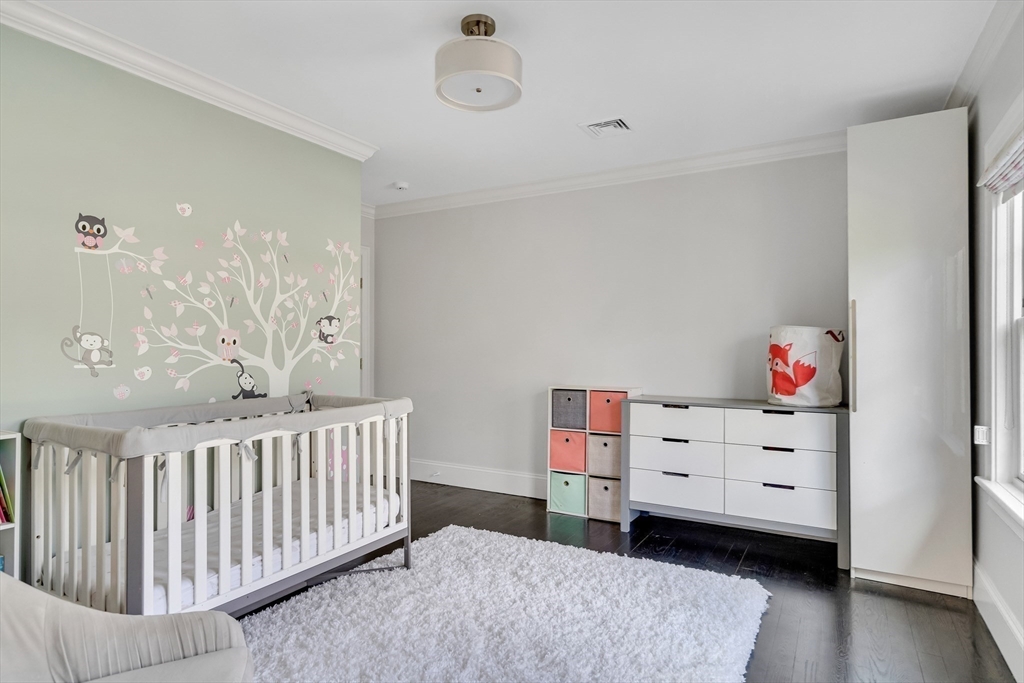 80 Buckman Drive Lexington, MA 02421 - Photo 15 of 29 a view of a bedroom with baby crib