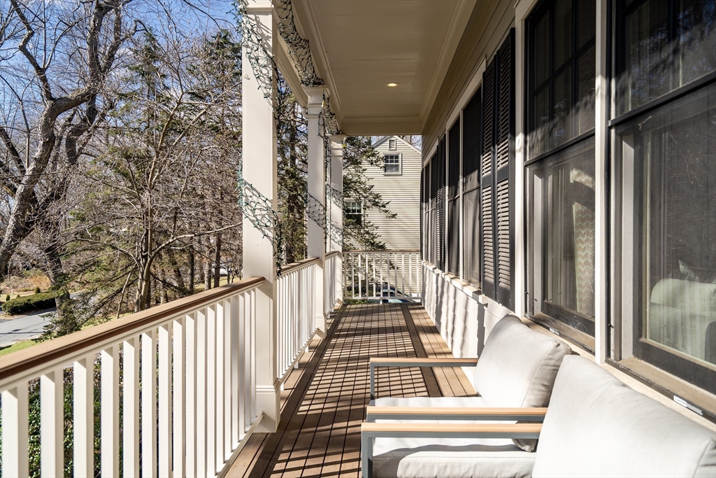 80 Buckman Drive Lexington, MA 02421 - Photo 2 of 29 a view of balcony with wooden floor and fence