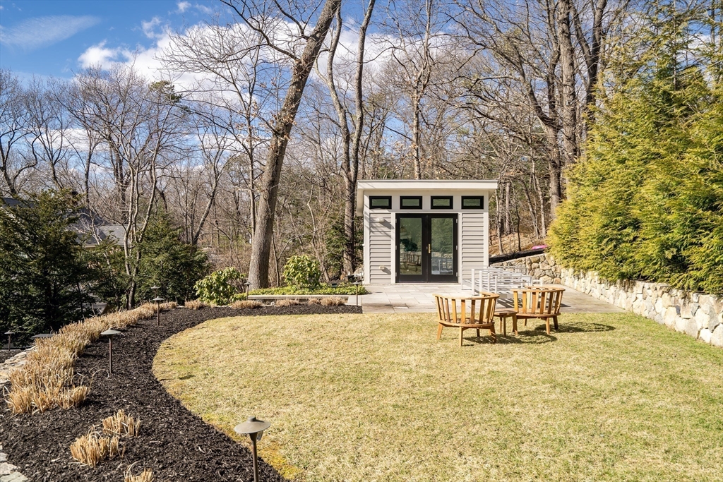 80 Buckman Drive Lexington, MA 02421 - Photo 24 of 29 front view of house with outdoor seating