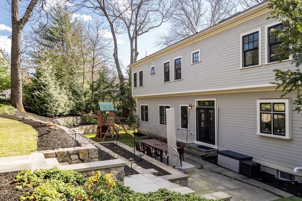 80 Buckman Drive Lexington, MA 02421 - Photo 25 of 29 a view of a house with backyard and sitting area