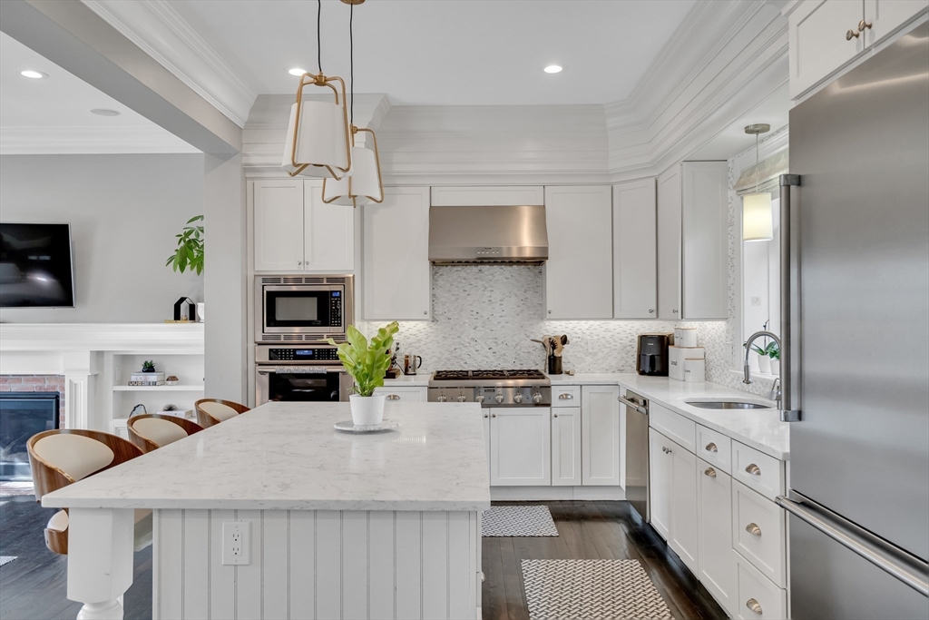 80 Buckman Drive Lexington, MA 02421 - Photo 6 of 29 a kitchen with stainless steel appliances a sink stove and refrigerator