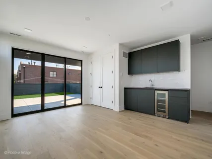 a view of an empty room with window and an empty room