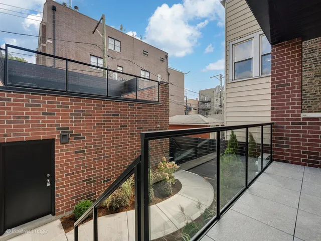 a brick building with a glass door