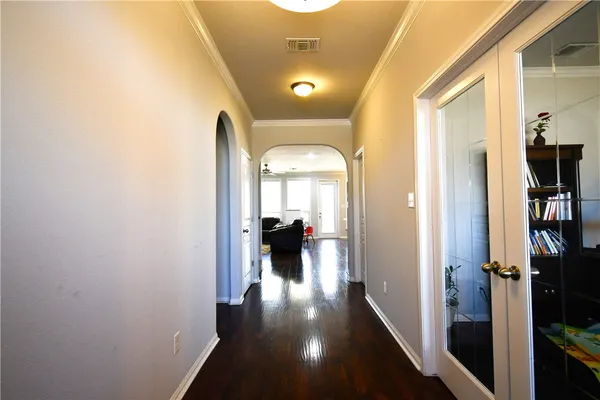 a view of a hallway with living room