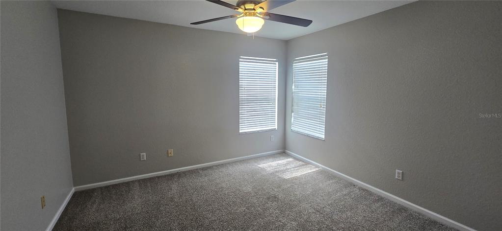 13426 Chariho Lane Windermere, FL 34786 - Photo 15 of 80 an empty room with a window and a fan