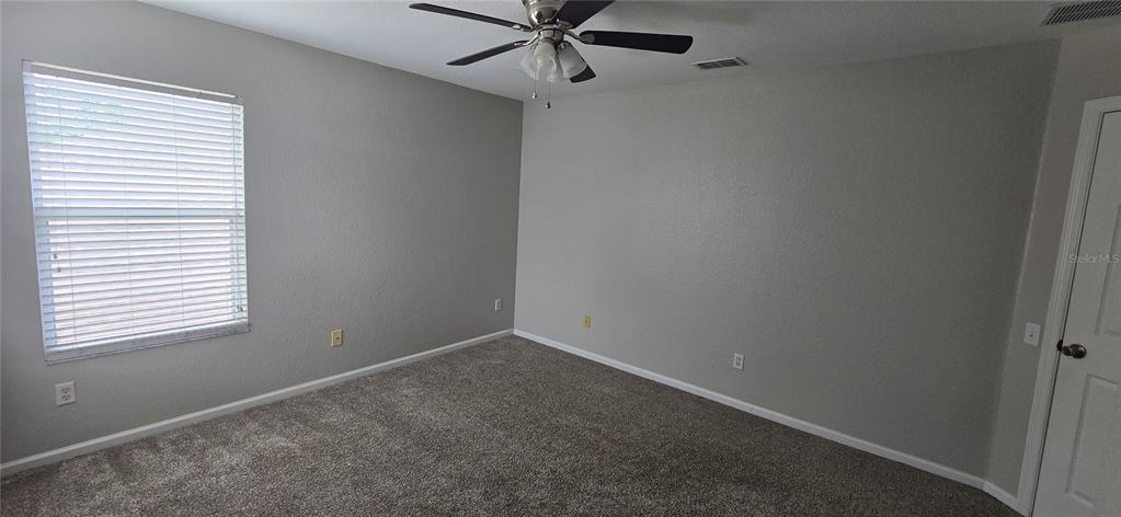 13426 Chariho Lane Windermere, FL 34786 - Photo 21 of 80 an empty room with a window