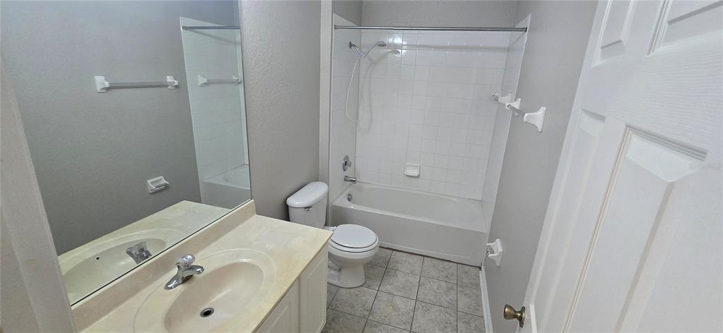 13426 Chariho Lane Windermere, FL 34786 - Photo 22 of 80 a bathroom with a sink a toilet and shower