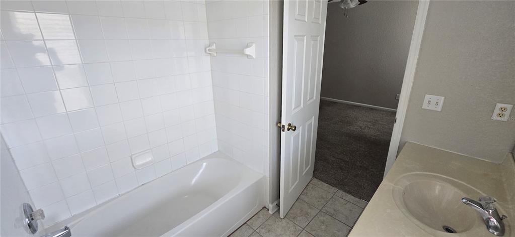 13426 Chariho Lane Windermere, FL 34786 - Photo 27 of 80 a bathroom with a sink and a tub