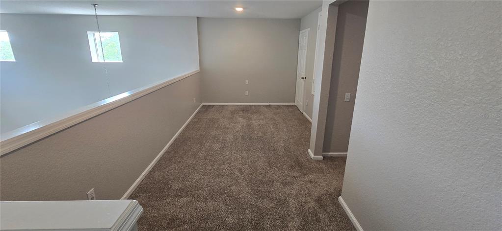 13426 Chariho Lane Windermere, FL 34786 - Photo 29 of 80 wooden floor in an empty room with a window
