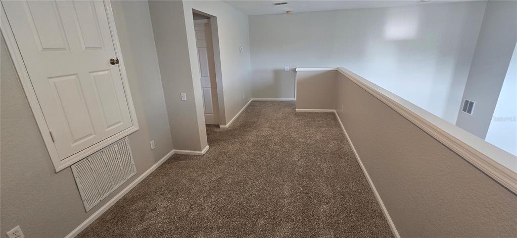 13426 Chariho Lane Windermere, FL 34786 - Photo 30 of 80 a view of a hallway with white walls