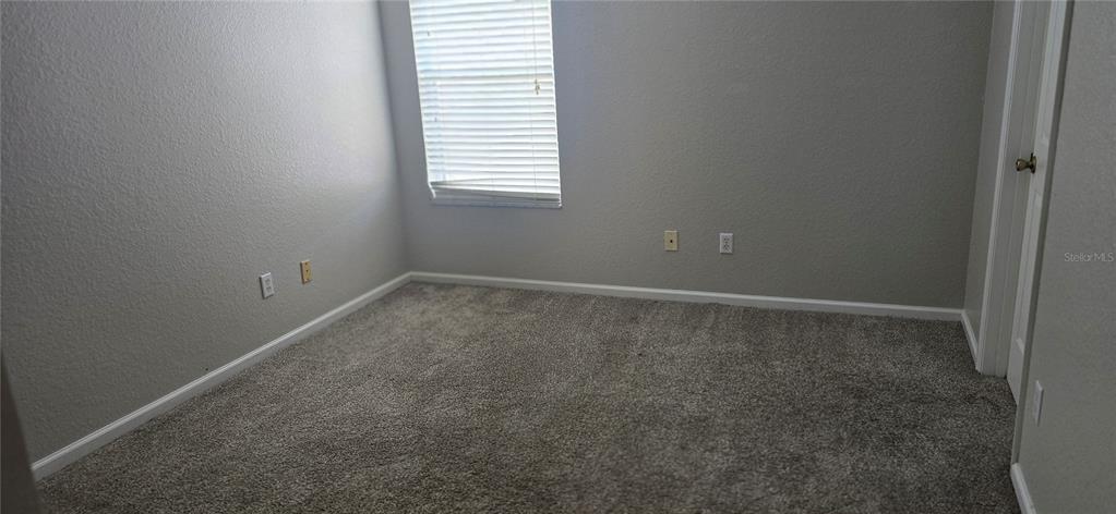 13426 Chariho Lane Windermere, FL 34786 - Photo 36 of 80 a room that has a window in it