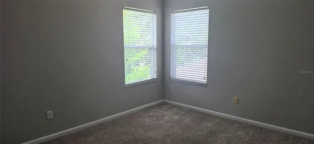 a kitchen with a stove and a refrigerator