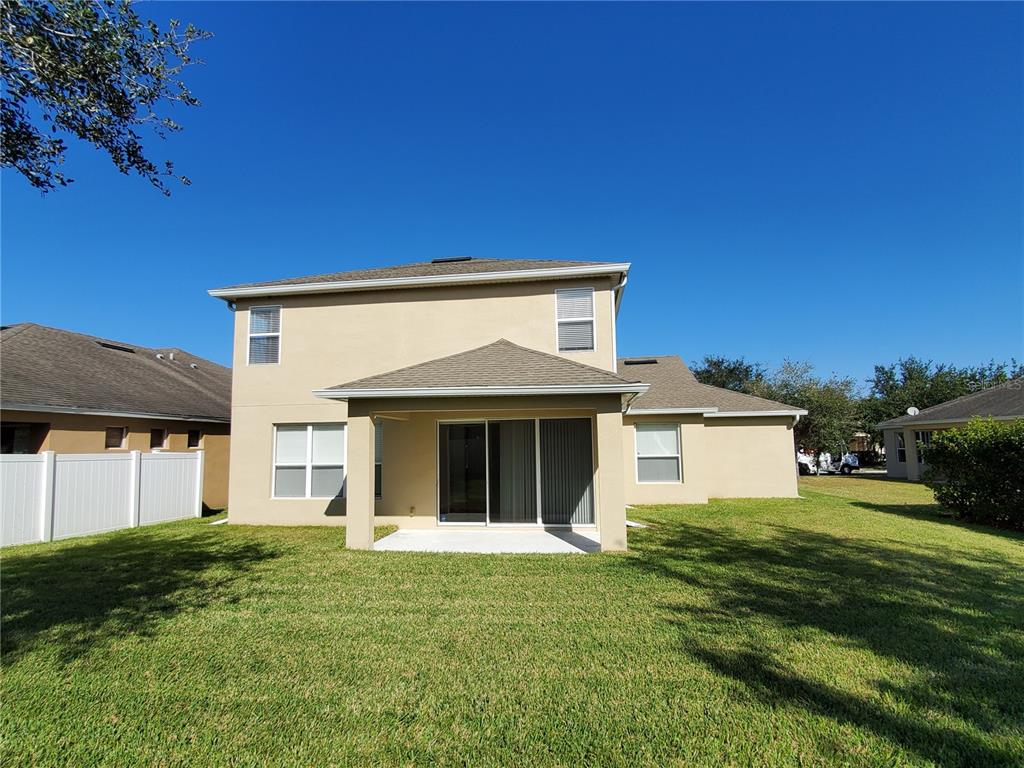 13426 Chariho Lane Windermere, FL 34786 - Photo 4 of 80 a front view of a house with a yard