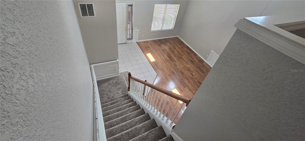 13426 Chariho Lane Windermere, FL 34786 - Photo 43 of 80 a view of a hallway with wooden floor and entryway