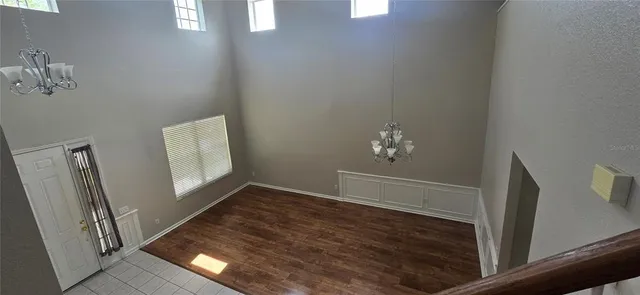 a white toilet sitting next to a bathroom sink and a mirror