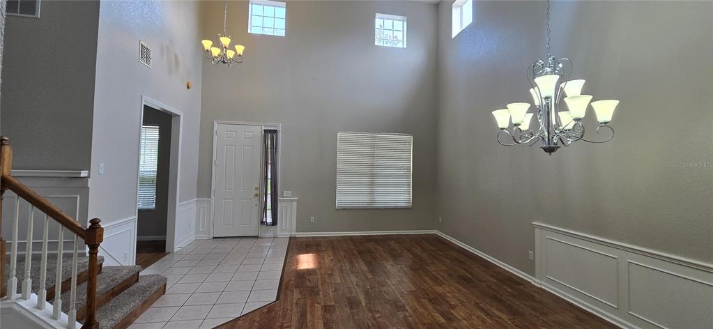 13426 Chariho Lane Windermere, FL 34786 - Photo 57 of 80 a view of a hallway with wooden floor and staircase