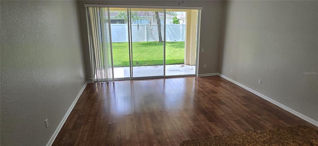 13426 Chariho Lane Windermere, FL 34786 - Photo 71 of 80 a view of wooden floor and windows in a room