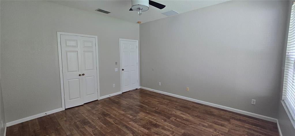 13426 Chariho Lane Windermere, FL 34786 - Photo 77 of 80 a view of an empty room with wooden floor