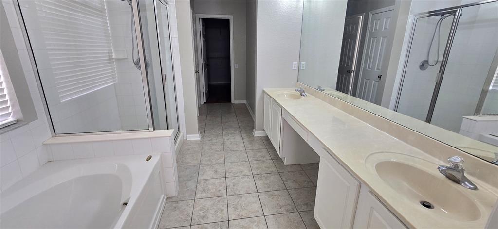 13426 Chariho Lane Windermere, FL 34786 - Photo 78 of 80 a bathroom with a sink a toilet and shower