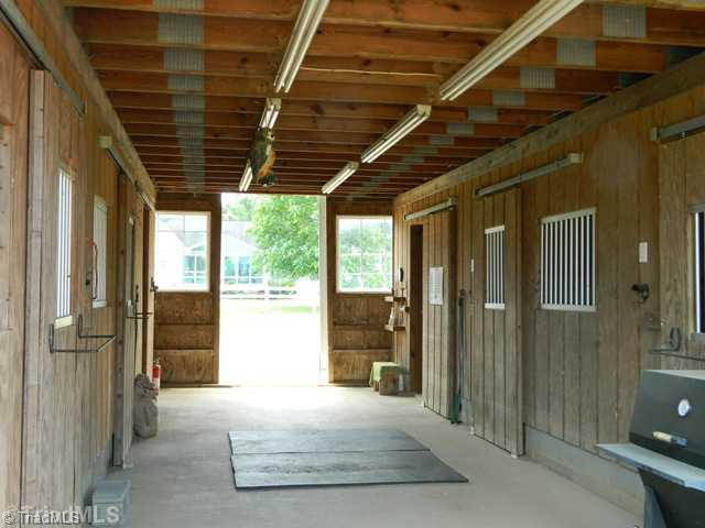 7556 Dubach Road Summerfield, NC 27358 - Photo 13 of 16 Stable/Barn. Direst access to pasture and riding ring!