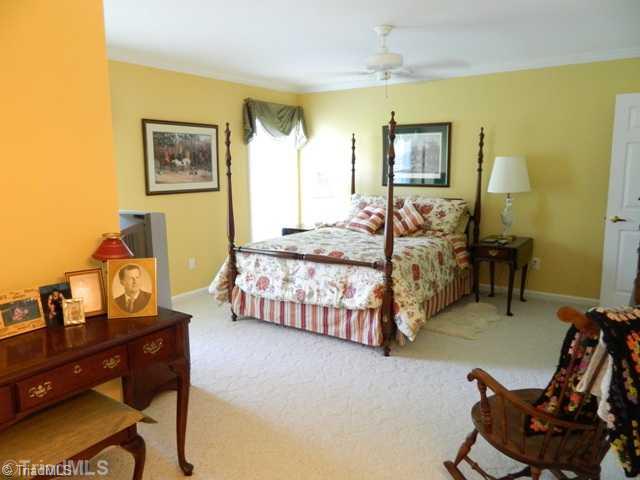 7556 Dubach Road Summerfield, NC 27358 - Photo 7 of 16 Master Bedroom. The master bedroom overlooks the pasture, horse lovers appreciate this thought! Attached dressing room, his and hers closets. Pull down attic stairs make this home expandable for a second level if desired.