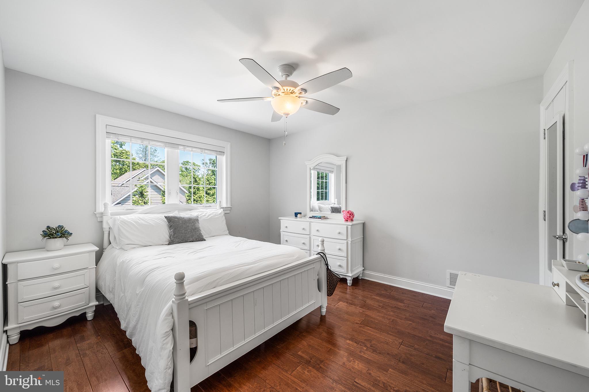 515 Old Eagle School Road Wayne, PA 19087 - Photo 26 of 40 a bedroom with a bed and a table in it