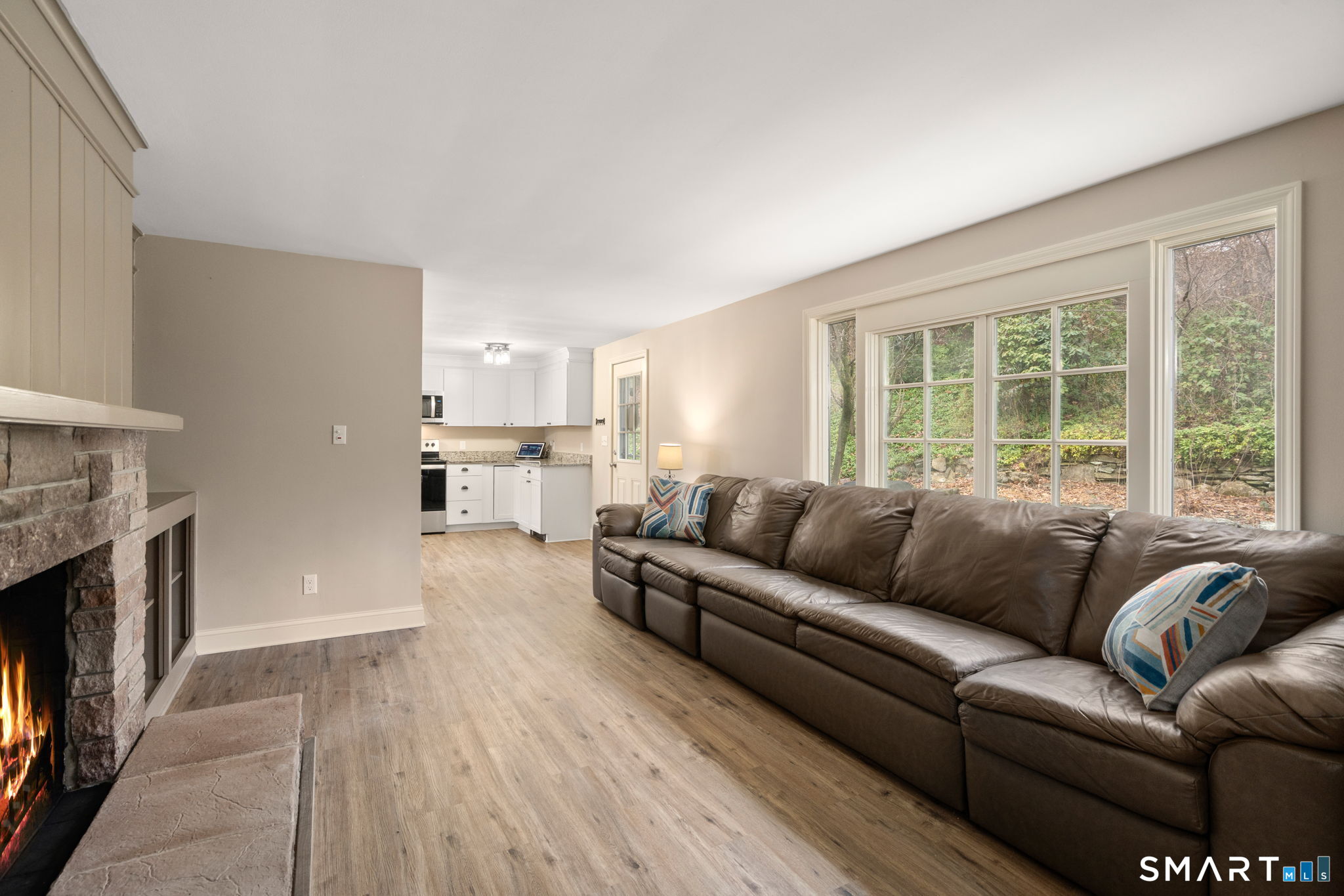 183 Old Hall Road Woodstock, CT 06281 - Photo 11 of 29 a living room with furniture and a fireplace