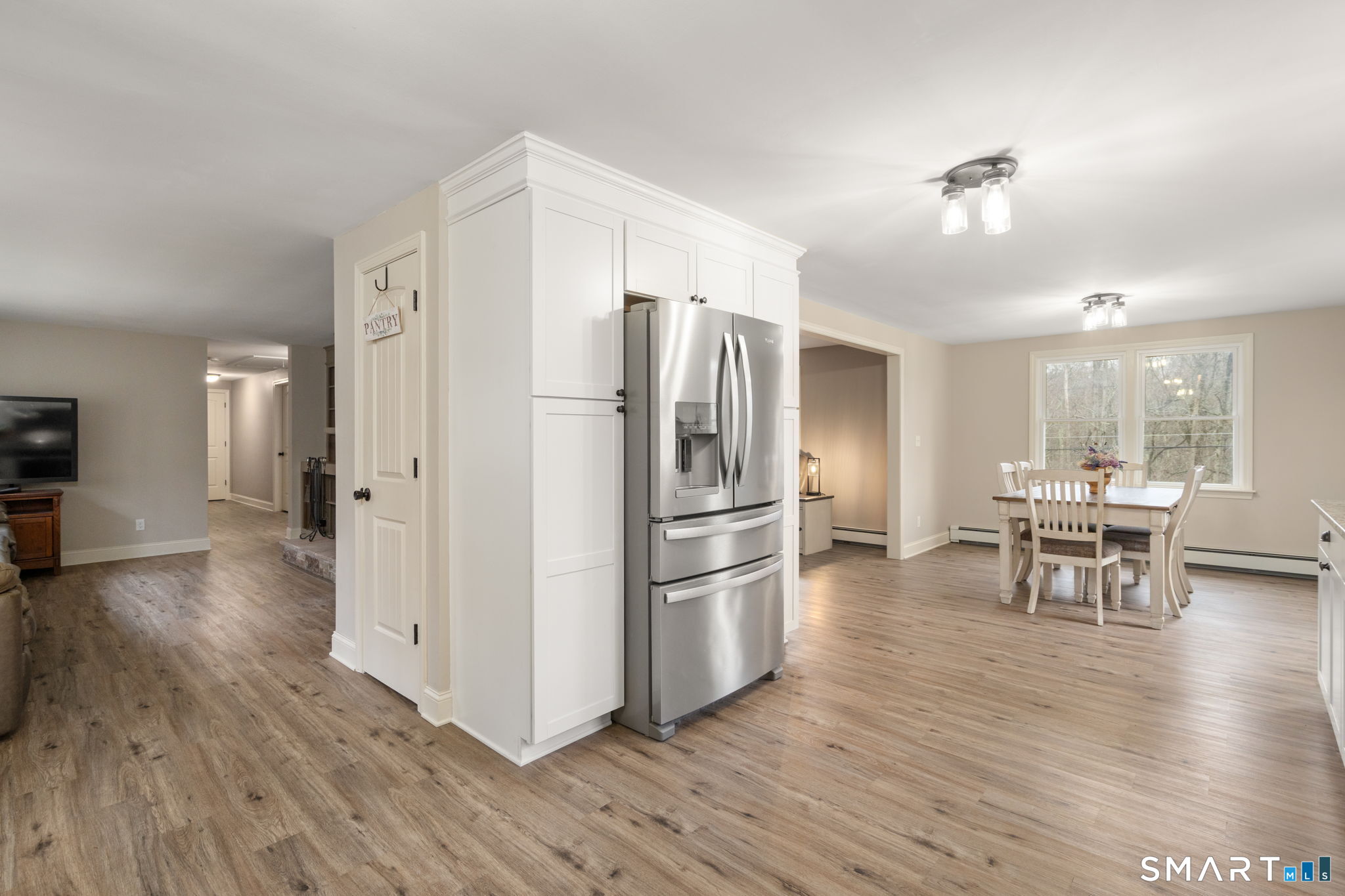 183 Old Hall Road Woodstock, CT 06281 - Photo 12 of 29 a kitchen with stainless steel appliances a refrigerator and wooden floor