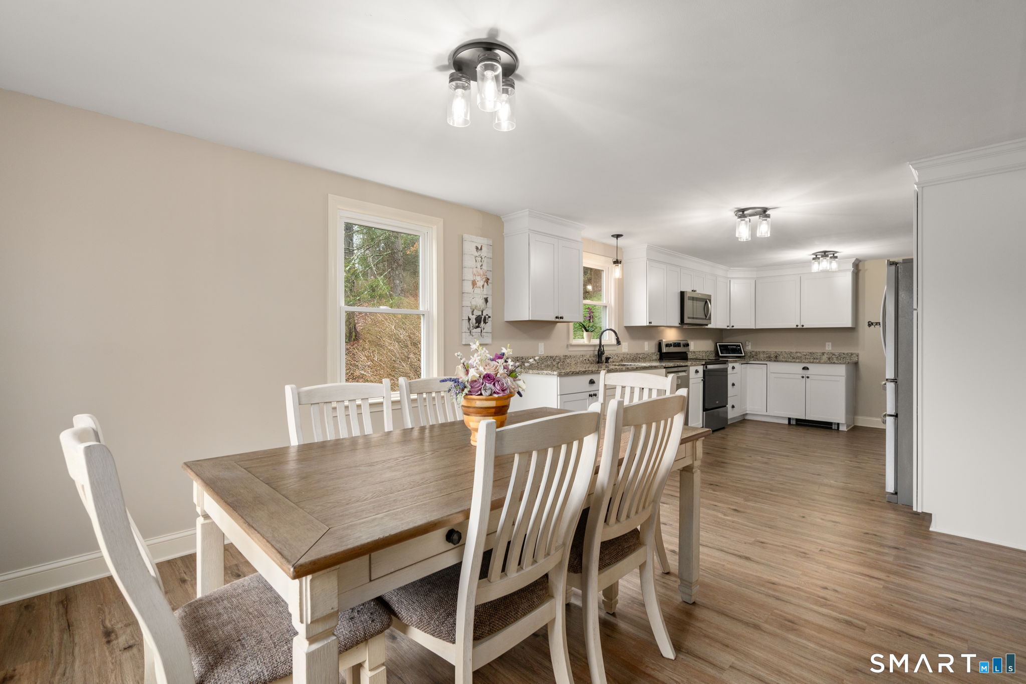 183 Old Hall Road Woodstock, CT 06281 - Photo 15 of 29 a view of a dining room with furniture and wooden floor