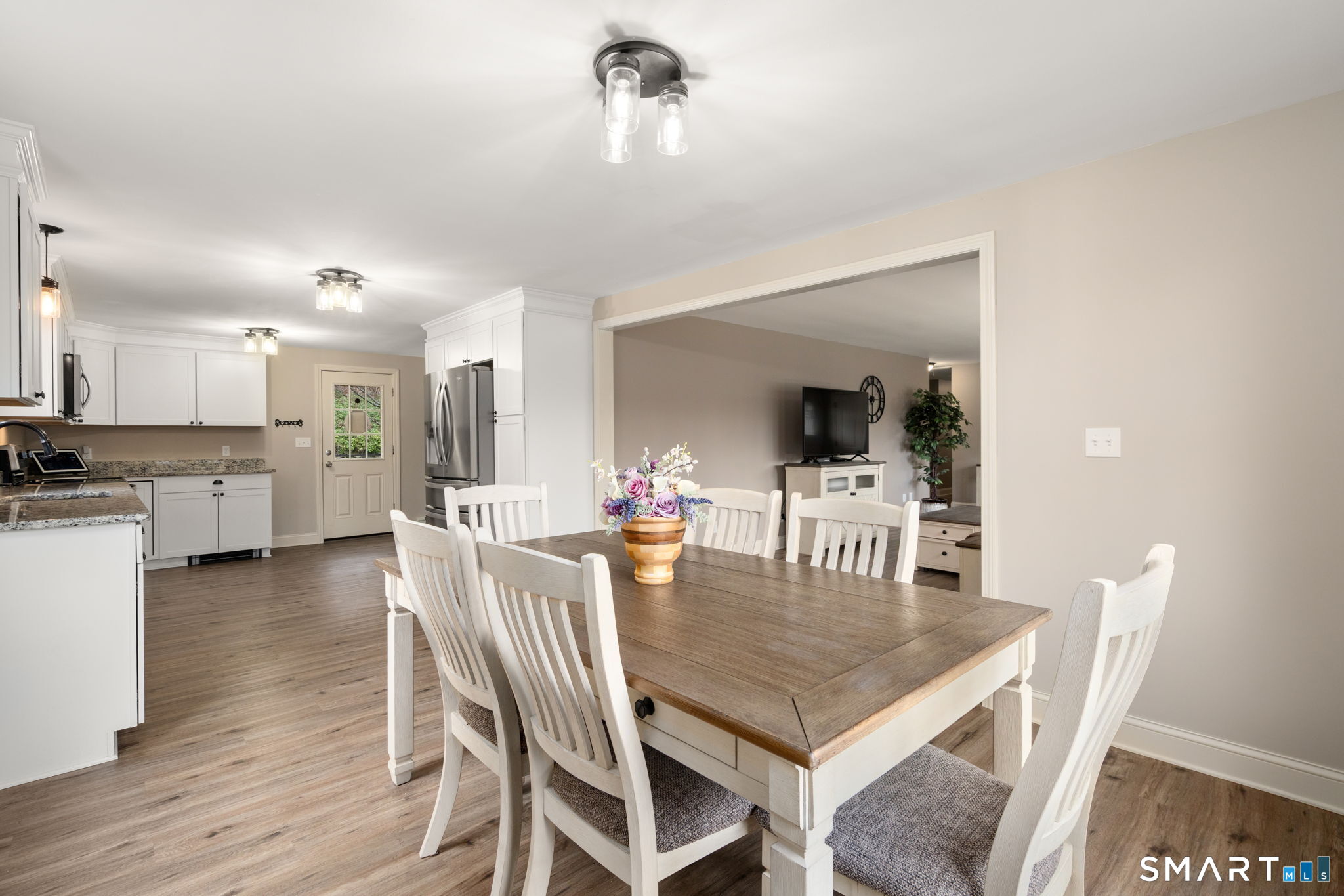 183 Old Hall Road Woodstock, CT 06281 - Photo 16 of 29 a view of a dining room with furniture and wooden floor