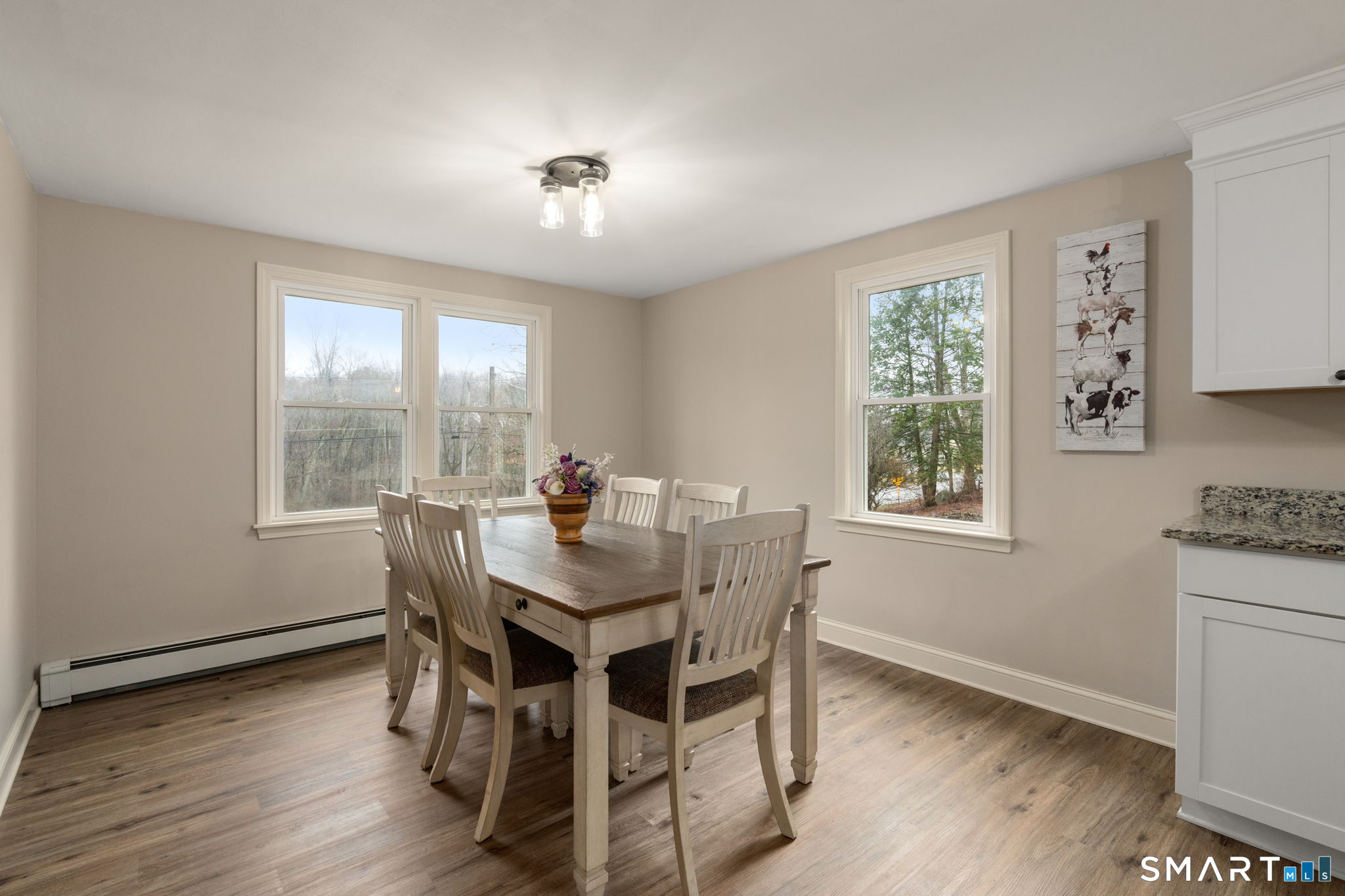 183 Old Hall Road Woodstock, CT 06281 - Photo 18 of 29 a view of a dining room with furniture and wooden floor