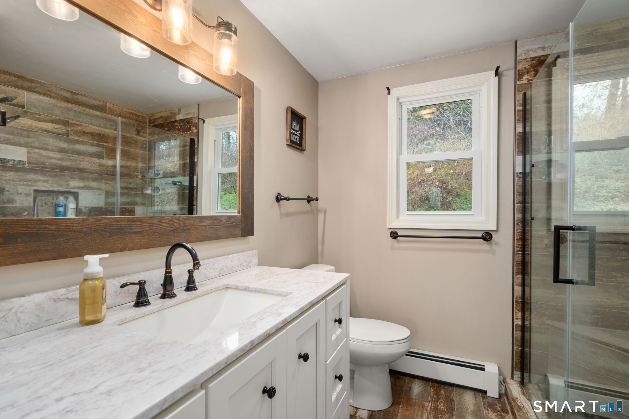 183 Old Hall Road Woodstock, CT 06281 - Photo 25 of 29 a bathroom with a granite countertop sink toilet and shower